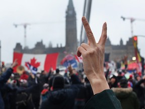 Protesters opposing vaccine mandates and COVID-19 health restrictions gather near the Parliament building in Ottawa on Thursday, Feb. 17, 2022.