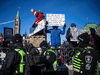 Police keep an eye on protesters gathered around Parliament Hill and Ottawa’s downtown core for the Freedom Convoy protest on Sunday January 30, 2022.