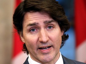 Prime Minister Justin Trudeau comments on the ongoing protests and blockades during a news conference on Parliament Hill in Ottawa on Monday, Feb. 14, 2022.