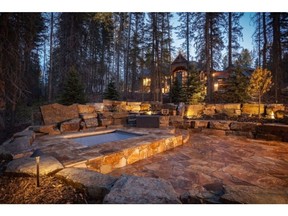 A landscaped hot tub area creates an atmospheric setting for relaxing in the hot tub.