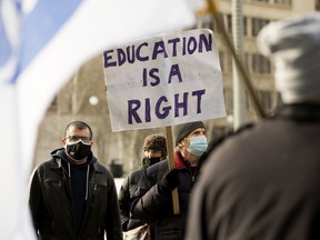 Representatives from post-secondary unions and supporters gather in solidarity of striking University of Lethbridge faculty at the Alberta Legislature in Edmonton on Feb. 11, 2022.