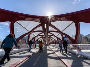 Calgarians spend the sunny morning on the Peace Bridge as the landmark bridge turns 10 years old in two days. Photographed on Tuesday, March 22, 2022.