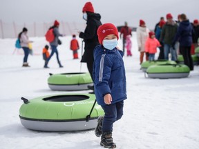 Isaac, 4, and his family are newcomers from China, with over 100 people from the Center for Newcomers, spent the day at the fun WinSport event Friday, March 25, 2022.