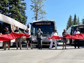 FILE PHOTO: Elected officials, Martin Bean CAO OF Roam Transit, Ric McIver Minister of Transportation and Municipal Affairs, Karen Sorensen Mayor of Banff, Brian Standish Chair of Bow Valley Regional Transit Services Commission, at the unveiling of the first electric transit buses in Banff National Park. The event also cut the ribbon opening the Town of Banff’s Roam Transit Operations Centre and solar system, a green building project designed to advance on its road towards a zero emissions service for the Bow Valley communities of Banff, Canmore, and Lake Louise and through the national park. Photo taken on June 29, 2021.