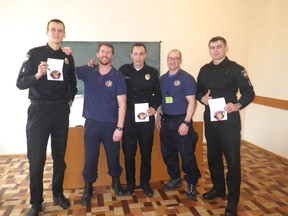Calgary Police Service member John Langford (second from left) was part of a small group of Calgary police who travelled to Ukraine in approximately 2015  to train Ukrainian police officers.