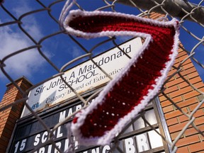 Sir John A. MacDonald School framed by the number seven, representing Treaty 7 in Calgary on Monday, March 28, 2022. Students and advocates are calling for the school to change its name due to Sir John A. MacDonald being a proponent of the residential school system.