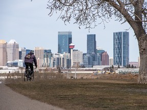 A cyclist enjoys a sunny day at the Beaver Dam Flats park in Calgary on Wednesday, March 30, 2022.