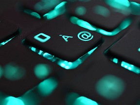 (FILES) This file photo illustration picture taken on June 25, 2019 in Brest shows a close-up view of a computer keyboard.