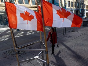 Canadian flags flutter along Stephen Avenue Mall in Calgary on Tuesday, March 15, 2022. It was about two years ago, on March 17, 2002, that Alberta declared a public health emergency as the COVID-19 pandemic took hold.
