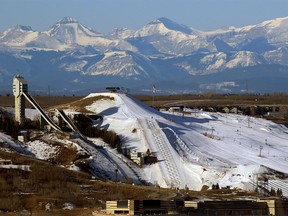 The Rockies rise in the distance behind Canada Olympic Park on Wednesday, March 17, 2021.