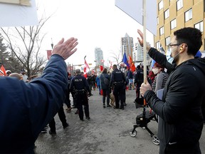 Counter-protesters and weekly protesters clashed again on 17 Ave. and 5A St. S.W. resulting in police barricading the counter-protesters in Calgary on Saturday, March 12, 2022.