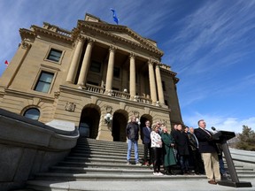 Olds-Didsbury-Three Hills United Conservative Party (UCP) constituency association president Rob Smith (at the podium), along with six other UCP constituency association presidents, and seven MLAs, speak about their discontent with recently announced changes to the UCP Special General Meeting voting rules during a press conference held below Premier Jason Kenney's office at the Alberta Legislature in Edmonton, on Thursday March 24, 2022.