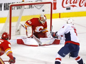 Washington Capitals forward Alex Ovechkin scores on Calgary Flames goaltender Dan Vladar at Scotiabank Saddledome in Calgary on Tuesday, March 8, 2022.