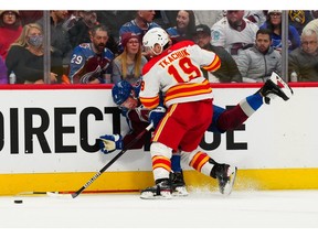 Calgary Flames left-winger Matthew Tkachuk checks Colorado Avalanche defenceman Cale Makar in the third period at Ball Arena on Saturday night.