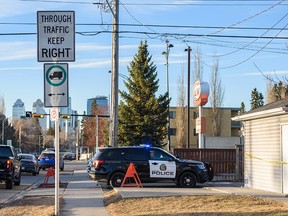 Calgary police at the scene of a fatal shooting on 16th Avenue N.W. on Monday, March 21, 2022.