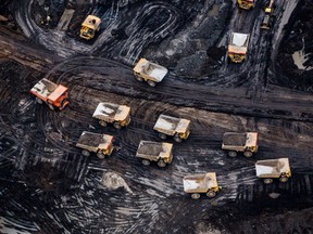 Heavy trailers are seen at the Fort Hills oil sands mine near Fort McMurray.  The oil and gas sector is the largest emitting industry in Canada.