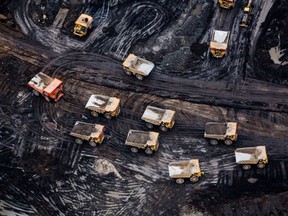Heavy trailers are seen at the Fort Hills oil sands mine near Fort McMurray. The oil and gas sector is the largest emitting industry in Canada.