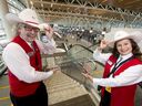 FILE PHOTO: White Hat volunteers Linda Platon and Gord Fuller pose for a welcome photo inside the new international terminal of the Calgary International Airport in Calgary, Alta., on Monday, Oct. 31, 2016.