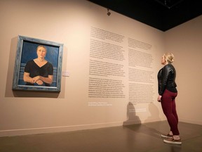 Stephanie Pahl, director of administration and culture at the Glenbow Museum, at the exhibit Uninvited: Canadian Women Artists in the Modern Moment at the Glenbow at the Edison. The painting is Portrait of Mrs. Carl Schaefer (Nee Lillian Evers), 1933 by Yulia Biriukova.