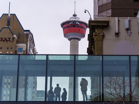 Downtown office workers congregate in a Plus-15 on a chilly day in Calgary on Wednesday, April 13, 2022.