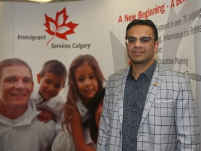 Hyder Hassan, CEO of Immigrant Services Calgary, poses outside the agency’s downtown office in Calgary on Wednesday, April 20, 2022. The agency will assist in settling Ukrainians arriving in Calgary.