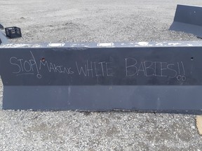 The Calgary Police Service is looking for information on the people behind racially-motivated graffiti on concrete barriers along 17th Ave. S.W. Calgary Police Service