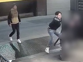 Calgary police are seeking two suspects caught on camera assaulting a vulnerable individual in the city's downtown around 11 p.m. on March 29, 2022.