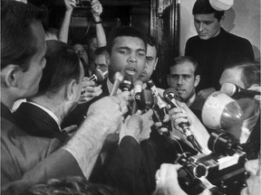 On this day in history in 1967, Muhammad Ali was stripped of his heavyweight boxing title after refusing induction into the U.S. army on religious grounds. This file photo taken on April 29, 1967 in New York shows Ali stating during a press conference that he refuses to go to the military service and fight in Vietnam. Heavyweight boxing legend Muhammad Ali, a 20th Century icon whose fame transcended sport during a remarkable career that spanned three decades, died on June 3, 2016. Archive photo.