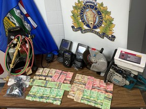 Cash, improvised explosives and stolen items seized by Mounties in relation to an ATM theft in Oyen, Alta. on March 24, 2022.