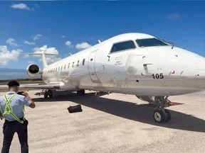 The Pivot Airlines plane sits at the Dominican Republic airport after 210 kilograms of cocaine were found stashed on board.