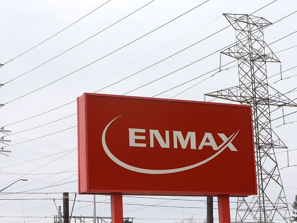 Power lines behind an Enmax sign in Calgary on Monday, April 25, 2022.