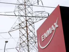 Power lines behind an Enmax sign in Calgary on Monday, April 25, 2022.