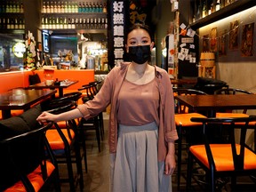 Bar owner of Wo Bar, Jacky Ip, 33, poses at a bar, amidst the coronavirus disease (COVID-19) pandemic, in Hong Kong, China, April 7, 2022.