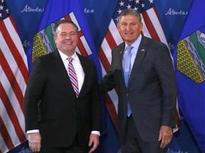United States Senator Joe Manchin of West Virginia and Alberta Premier Jason Kenney speak to media during the senator’s visit at the McDougall Centre in Calgary on Tuesday, April 12, 2022.