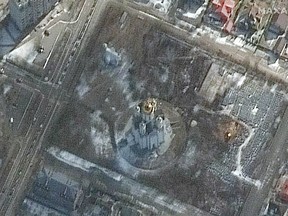A satellite image shows first signs of excavation of a mass grave on the grounds of the Church of St. Andrew and Pyervozvannoho All Saints, in Bucha, Ukraine, March 10, 2022.