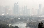 FILE - Calgary's skyline is barley visible from Edworthy Park as wildfire smoke continues to blanket the city. Saturday, August 14, 2021. 