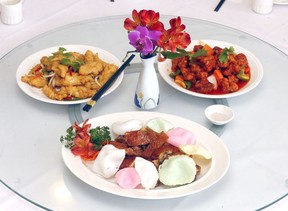 Crispy Chicken with Garlic Slices, in front, Salt and Pepper Squid, top left, and Sweet and Sour Pork with Pineapple dishes from the Golden Sands Chinese Seafood Restaurant. Darren Makowichuk/Postmedia