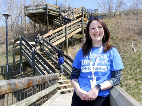 Emma MacIsaac, director of Inn from the Cold, and volunteers participate in the 11th annual Steps to End Homelessness on the steps of Crescent Heights in Calgary on Sunday, April 24, 2022. Darren Makowichuk/Postmedia
