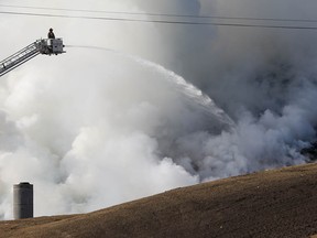 Calgary fire fighters battle a fire at ECCO Recycling and Energy on Saturday, April 30, 2022.