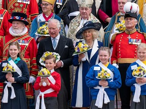 Prince Charles, Prince of Wales, and Camilla, Duchess of Cornwall, pose for a photo after taking part in the Royal Maundy Service at St. George's Chapel in Windsor on April 14, 2022.