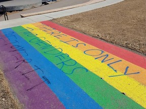 Airdrie RCMP are asking for the public's help in identifying the person or people responsible for defacing the rainbow pathway in Nose Creek Regional Park.