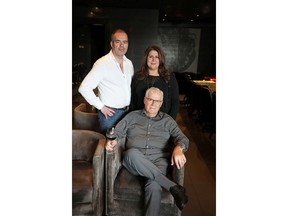 Gerry Stuart, Connie Giannoulis-Stuart and Con Giannoulis, seated, the co-owners of Caesar's Steak House, are celebrating 50 years in business.