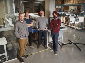 Alex MacGregor, from left, CEO of Qube Technologies, with COO Eric Wen, CTO Greg Taylor, and co-founder and vice-president of innovation Tej Grewal, have developed an emissions monitoring device.
