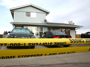 Calgary police investigate a shooting at a home on Radcliffe Close S.E. on Friday, April 1, 2022.