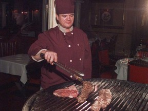 SNS0704-Steak2: CALGARY - Chef Richard Panteluk grilling a steak at Caesar's Steak House. With Cinda Chavich story on how to grill the perfect steak for Southam food package moving Jul 4.