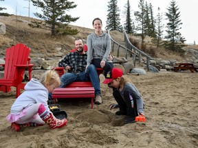 Scott Peake and Lynsi Jenkins hang out at the beach at Ghost Lake with their children, Nia, 3, and Sawyer, 6.