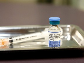 FILE PHOTO: A vial of the measles, mumps, and rubella (MMR) vaccine is pictured at the International Community Health Services clinic in Seattle, Washington, U.S., March 20, 2019. Picture taken March 20, 2019.  REUTERS/Lindsey Wasson/File Photo