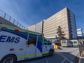 Ambulances sit outside the emergency entrance at Foothills Medical Centre in Calgary on Thursday, March 10, 2022.