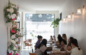 The bright and cheerful interior of And Some Flower Cafe in Sunnyside.  Azin Ghaffari/Postmedia