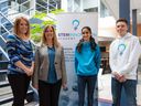 Stem Innovation Academy co-founders Sarah Bieber, left, and Lisa Davis, and Grade 9 students Inayat Kang and Wyatt Peterson pose for a photo at the new high school Calgary's new location on Tuesday, May 10, 2022. 